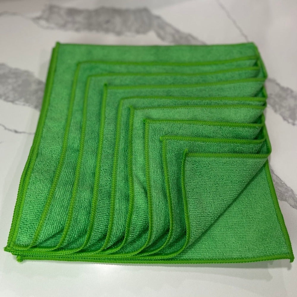 12 inch by 12 inch Green Life Saver Microfiber Cloths / towels 12 pack top view photo on Quartz countertop