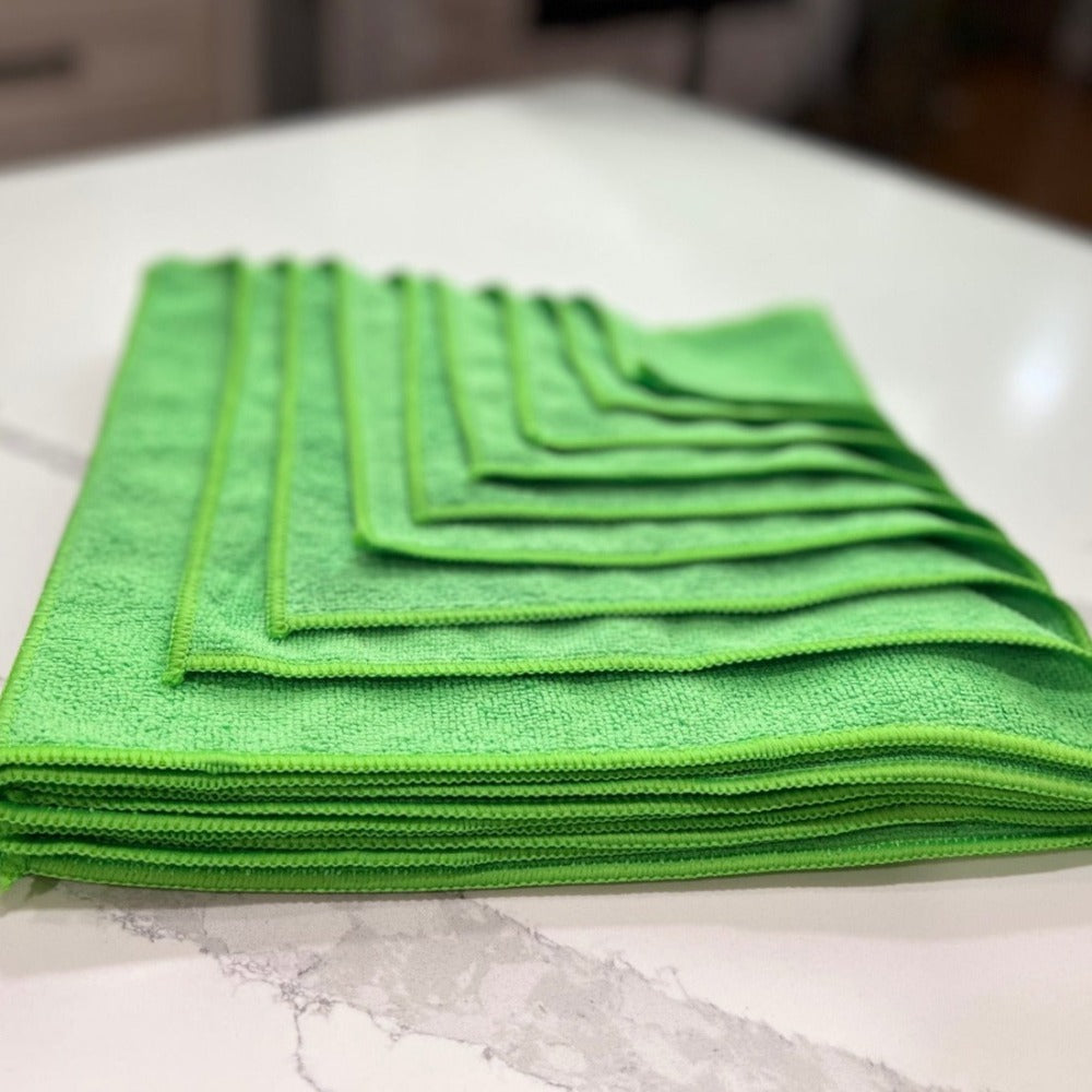 12 inch by 12 inch Green Life Saver Mini Microfiber Cloths / towels 12 pack angled view on Quartz countertop